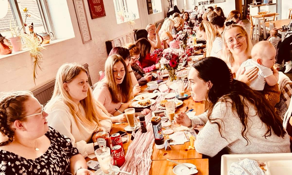 Community gathered around the table at The Good Loaf